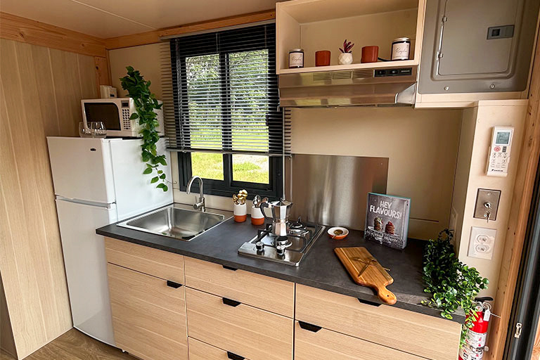 An accommodation delivered with a fuly equipped kitchen